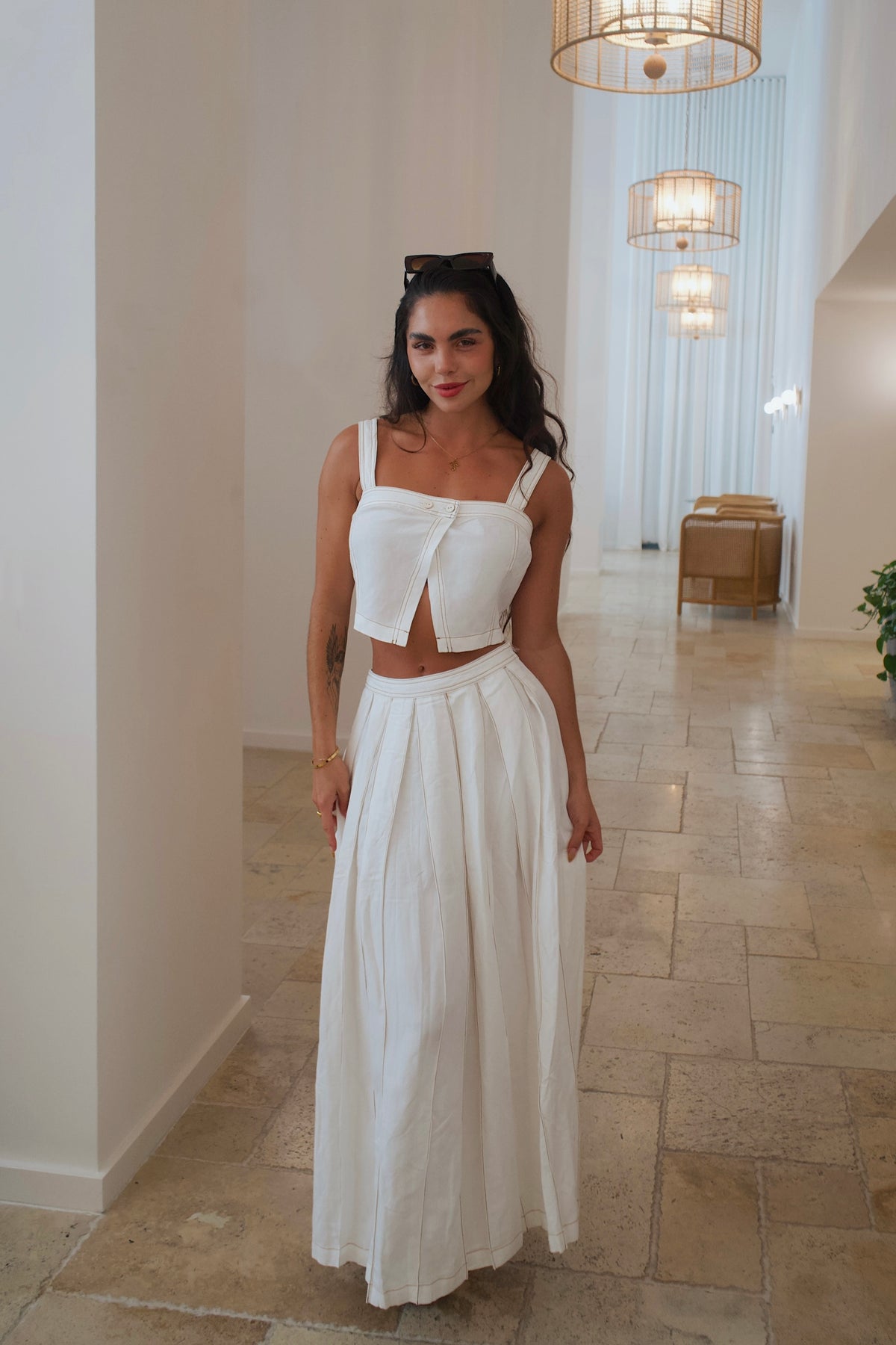 Elegant cream linen set with playful contrast stitching on top and skirt