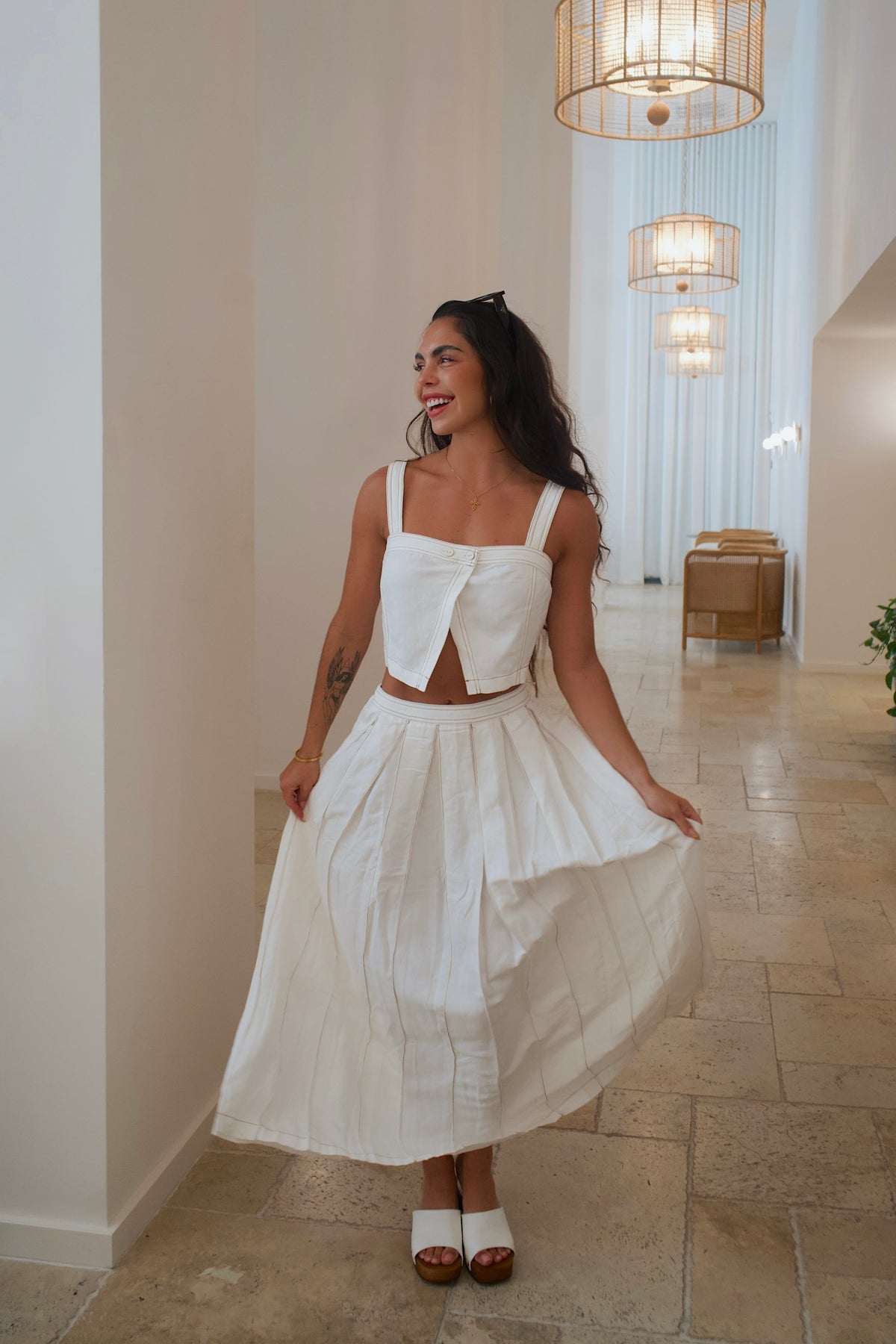 Cream linen crop top with square neckline and coconut button front