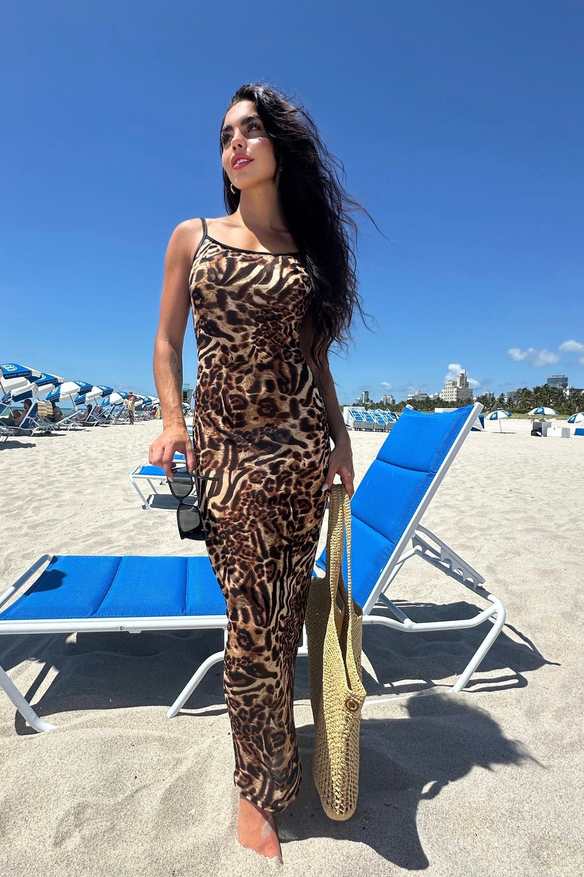 Curve-hugging sheer leopard mini dress perfect for late-night adventures