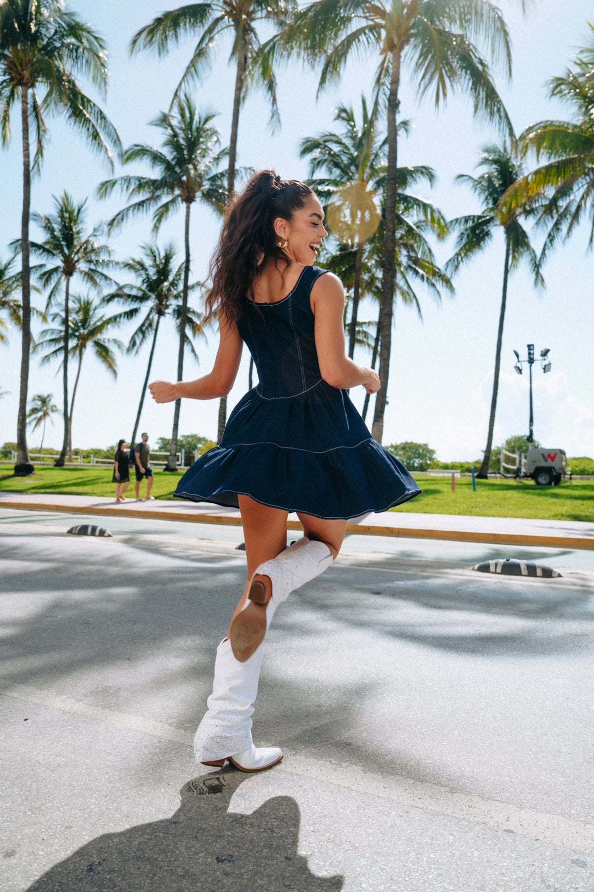 Dark indigo mini dress with square collar and feminine corset-style waist design