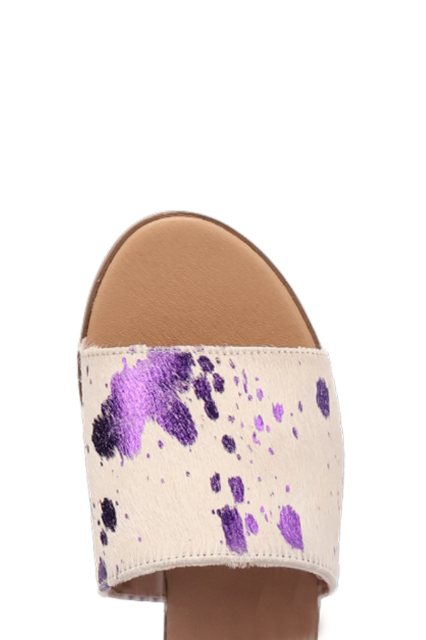 Side view of 1/2" heel calf hair sandal with chic and minimal elevation