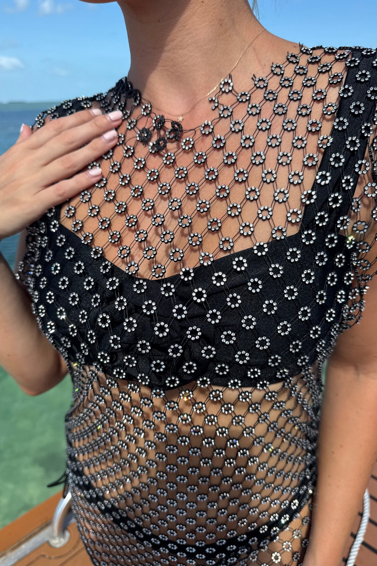 Detail shot of the lace-up adjustable sides on beach cover-up
