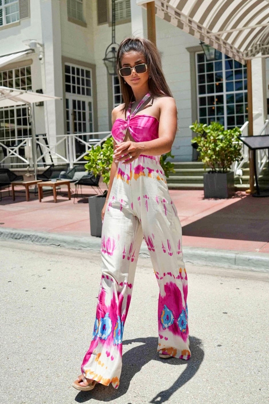 Front view of Ella’s Tie Dye Jumpsuit featuring halter neckline and wide leg fit
