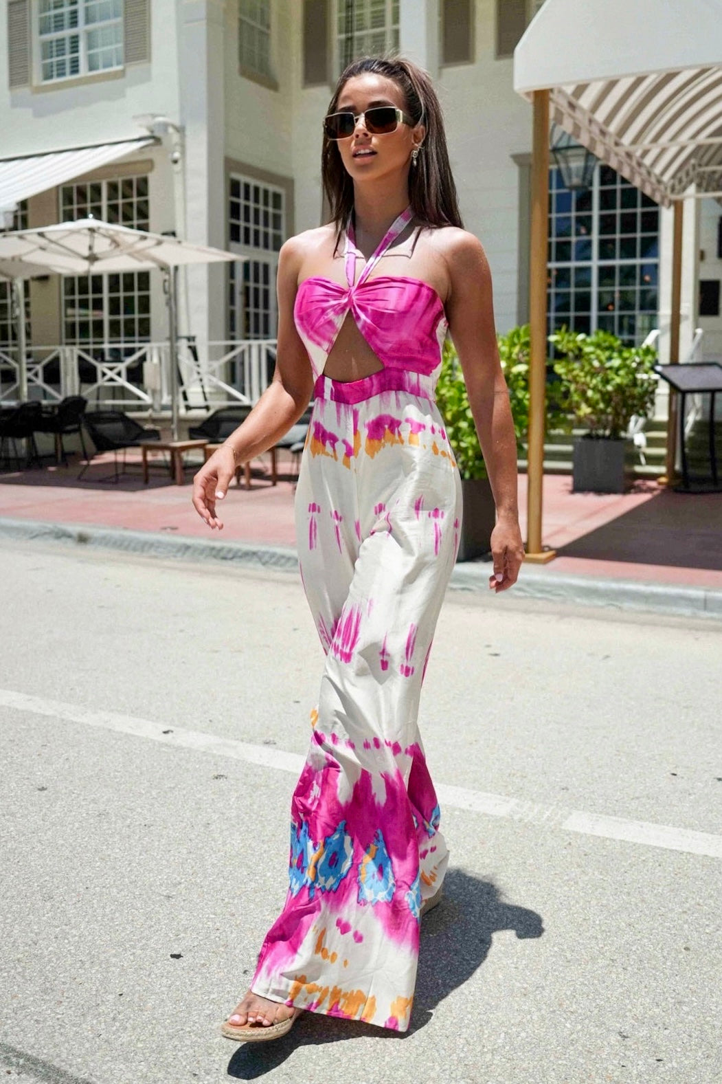Flirty halter top tie dye jumpsuit highlighting shoulders and collarbone
