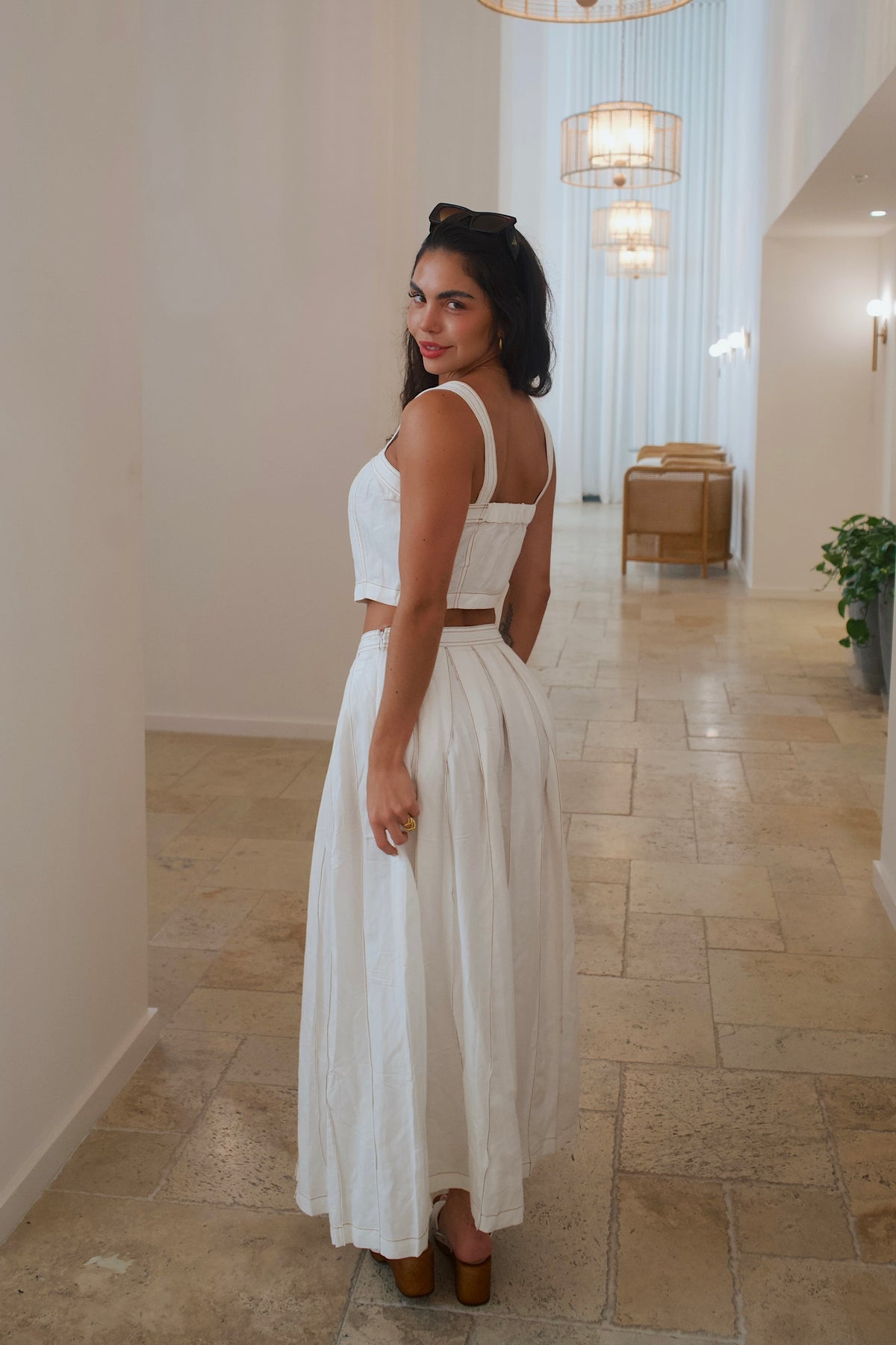 Lightweight linen two-piece set with pleated maxi skirt and contrast stitching
