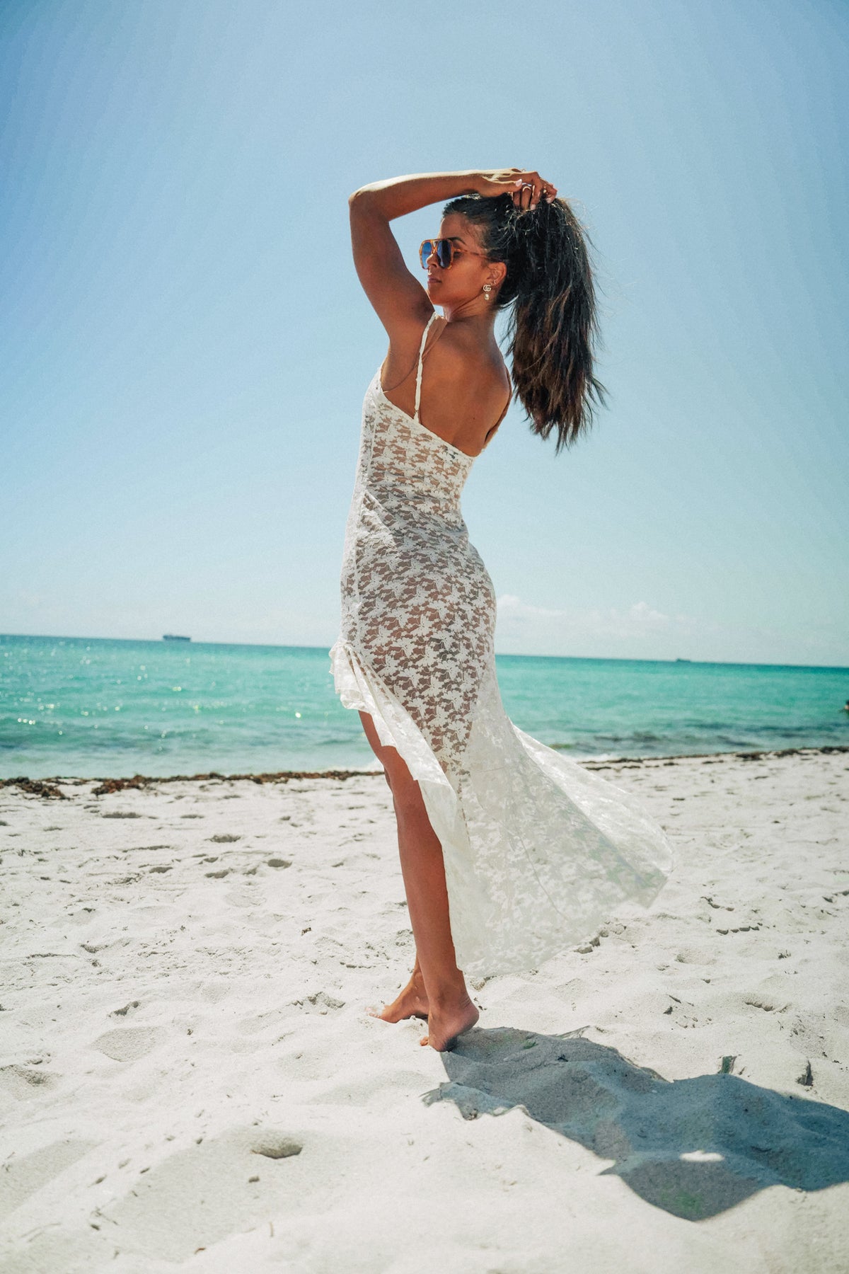 Lioness Lace Dress in cream featuring floral lace, midi length, and romantic detailing
