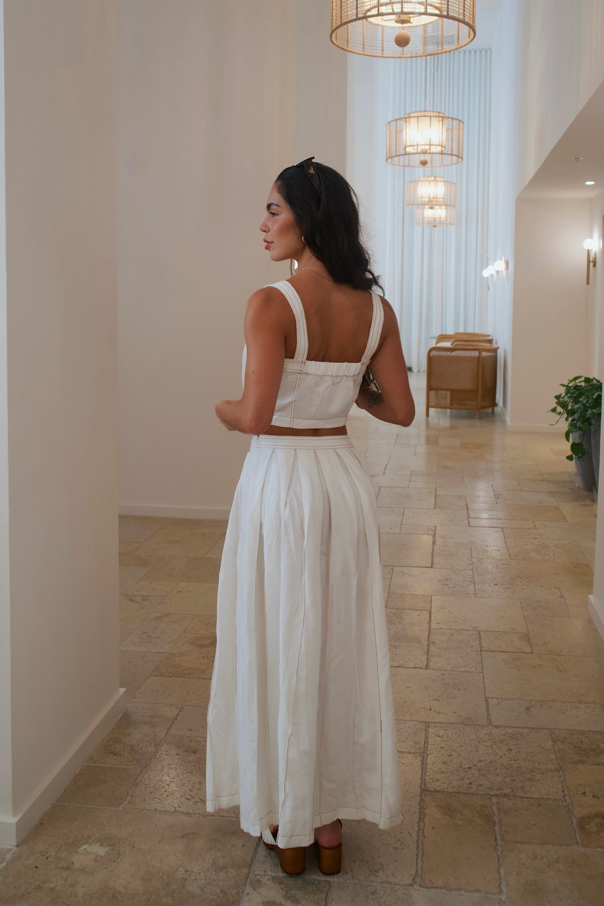 Flowy cream maxi skirt with pleated design, perfect for summer style
