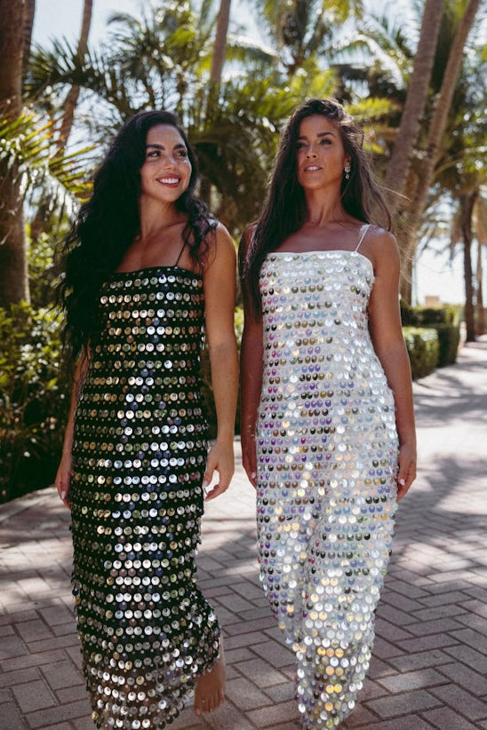Sheer black slip dress with shimmering sequins and sultry silhouette for red carpet or parties
