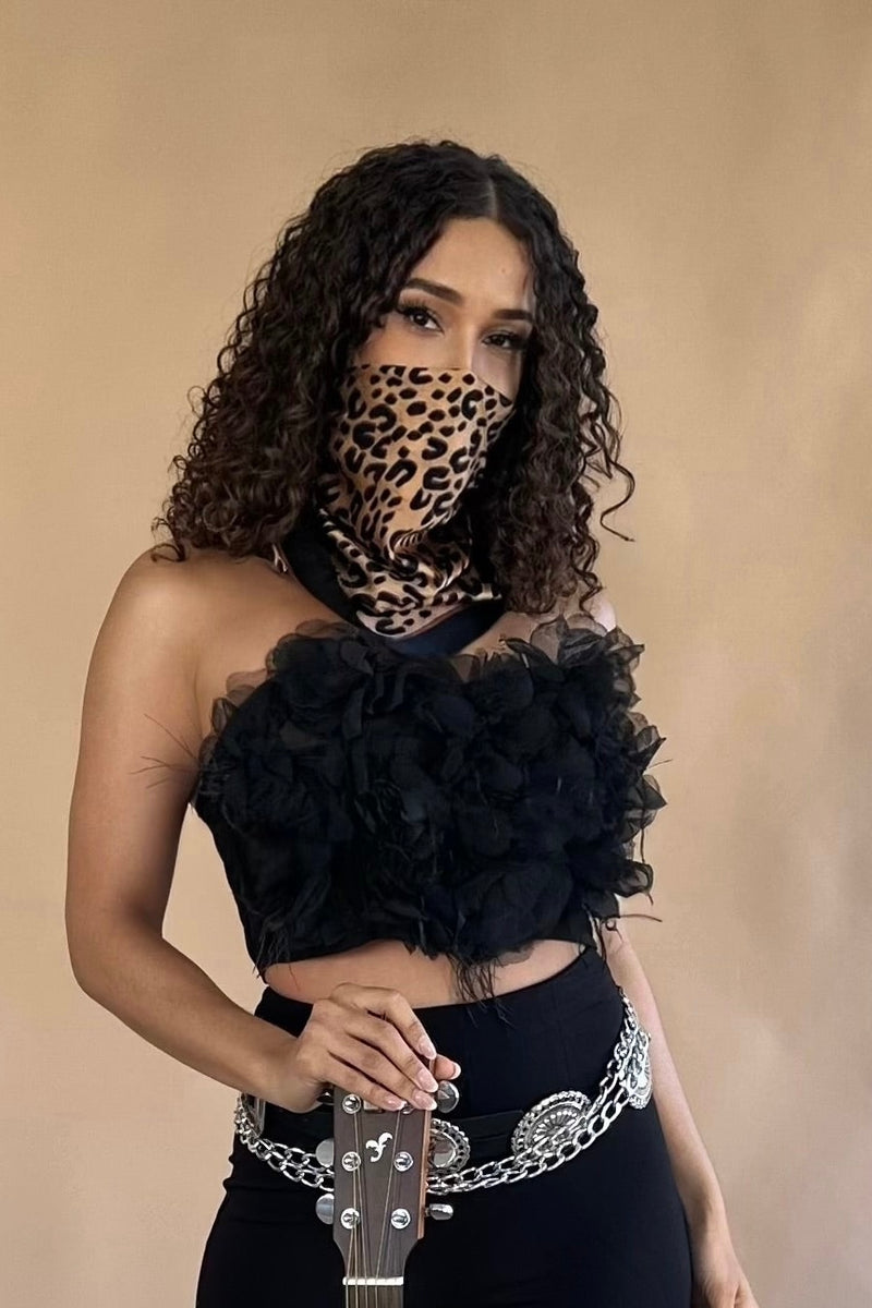 Versatile silky leopard headscarf, adding a rebellious touch to any outfit.