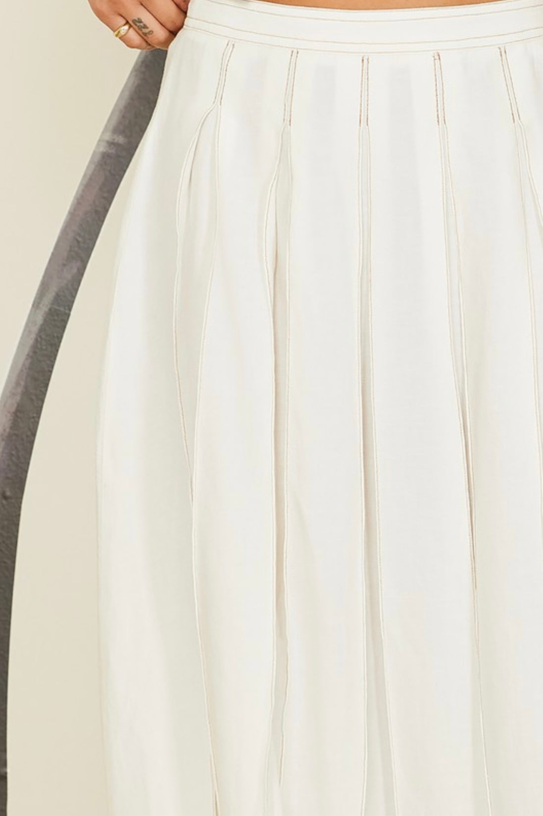 Tropical-inspired linen set in cream with coconut buttons and breathable fabric
